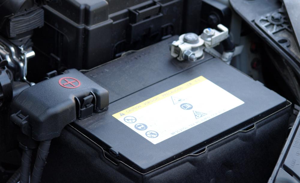 An auto diagnostic technician may test a car's battery.