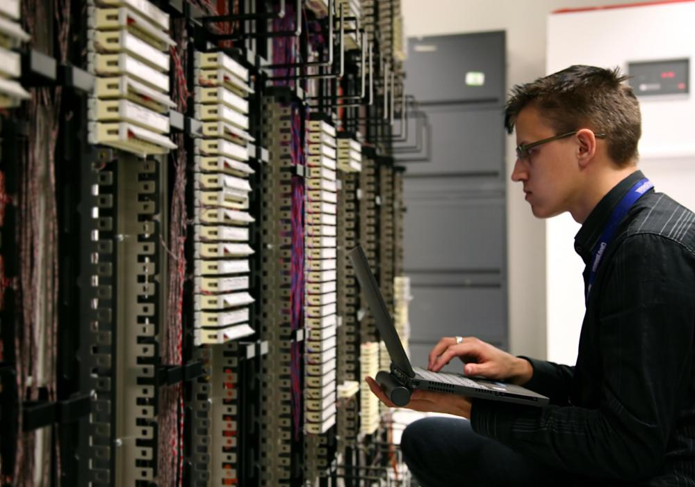 An applications engineer working on a computer server.
