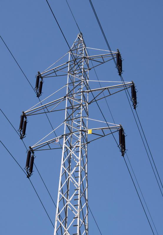 Linemen work on electrical lines and transformers.