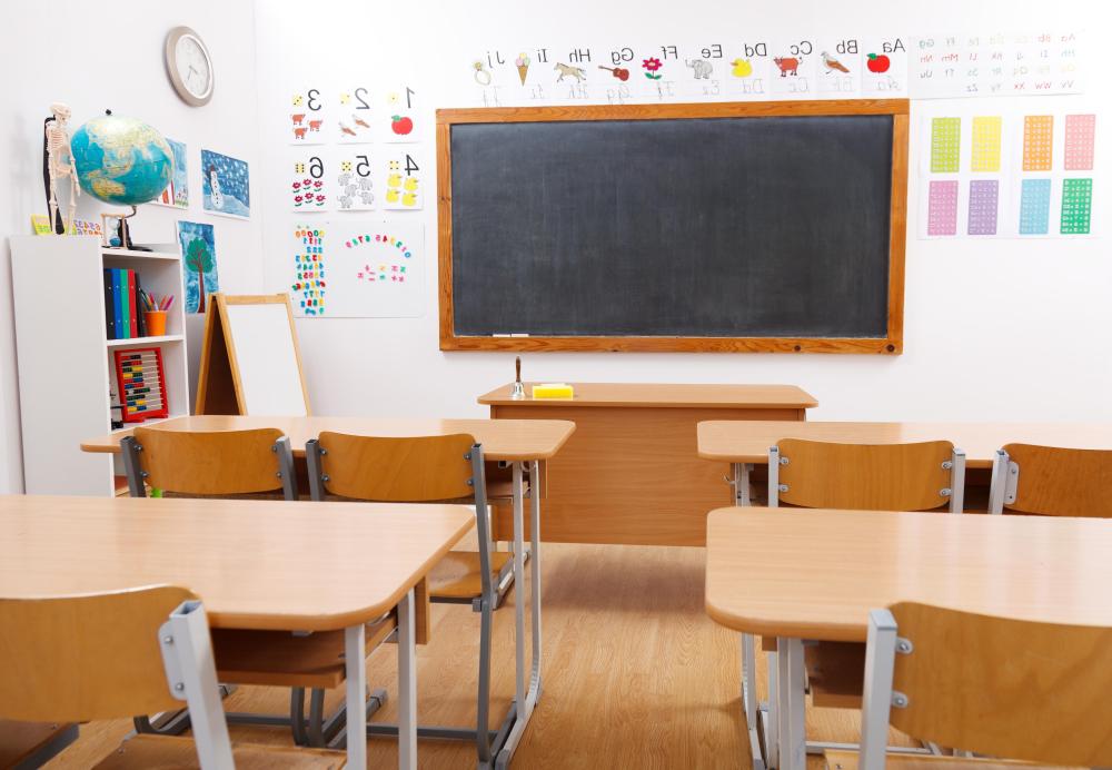 An instructional aide might prepare lessons and help the teacher set up the classroom.