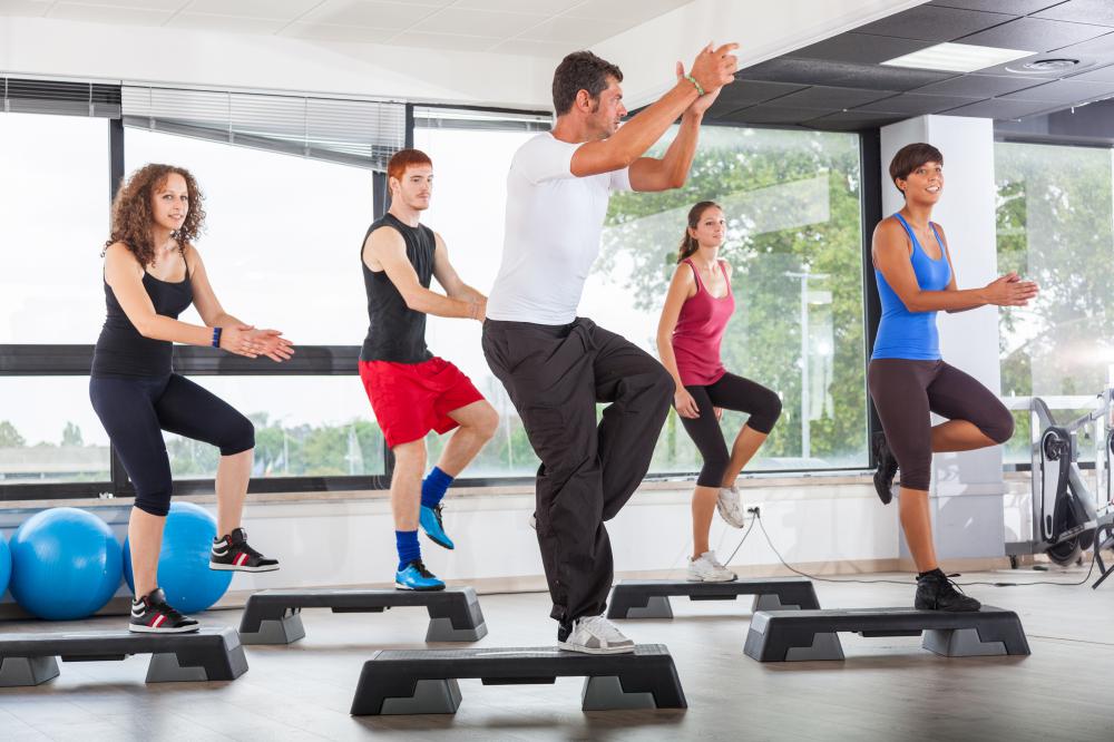 Some fitness instructors hold classes at gyms for large groups of students.