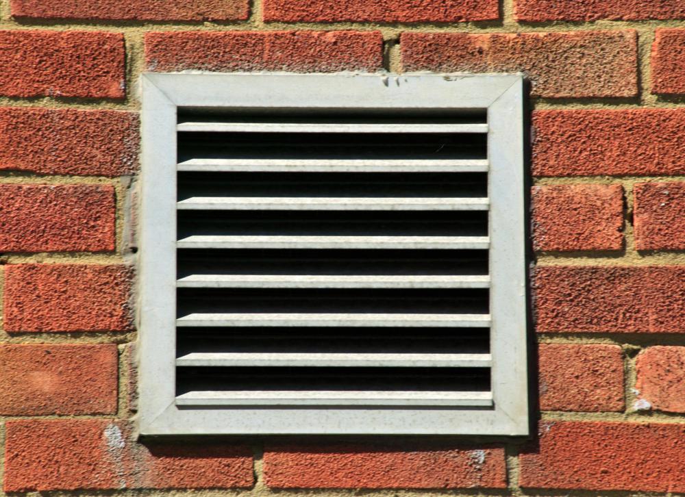 Exterior wall vent leading to an HVAC system.