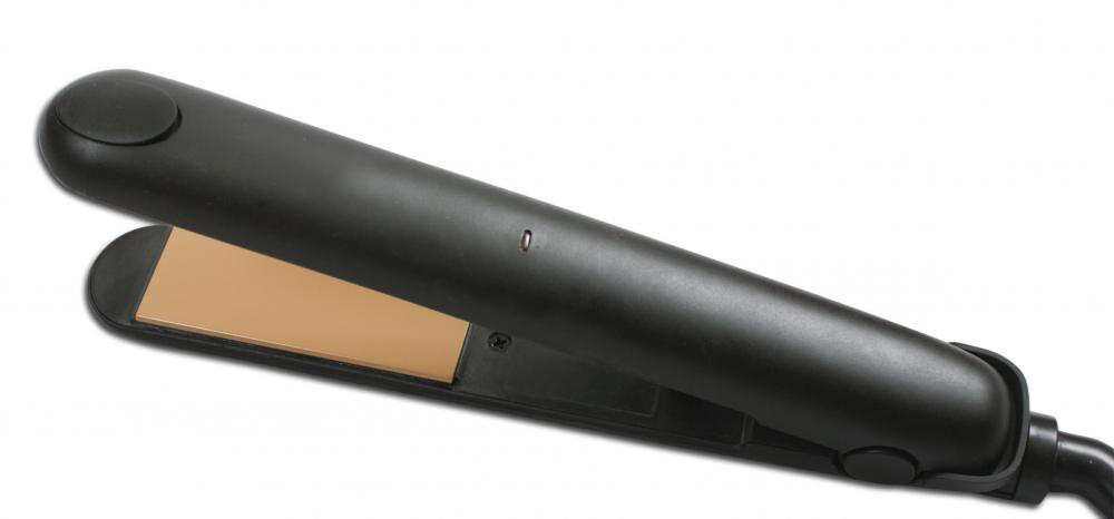 Beauticians use various hair styling tools, including flat irons.