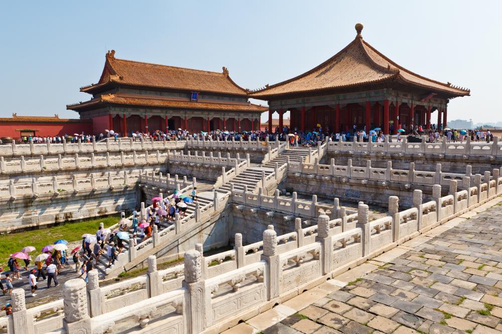 A tourism manager helps arrange and sell tour packages, like a trip to China to visit the Forbidden City.