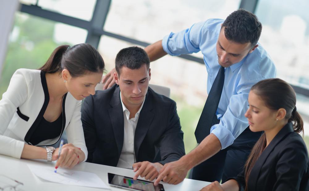 An application consultant helps to train members of an organization on how to use software that the company has purchased.