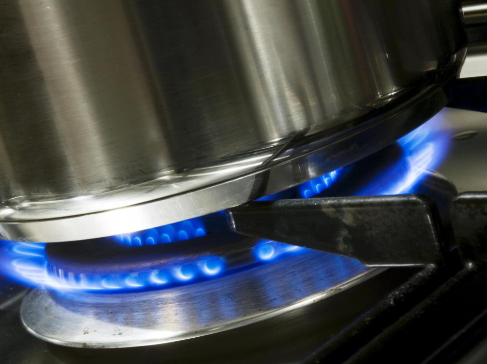 Fire inspectors in a commercial kitchen may check for proper operation of a gas stove and vent hood.