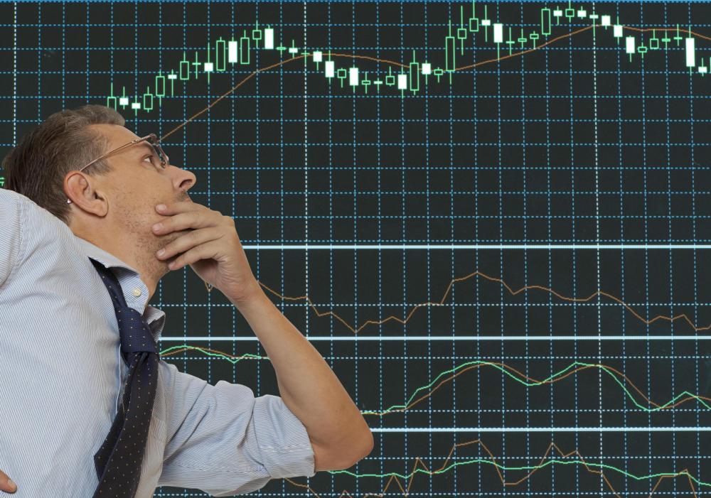 A financial analyst assesses assets, debts, investments and growth potential.