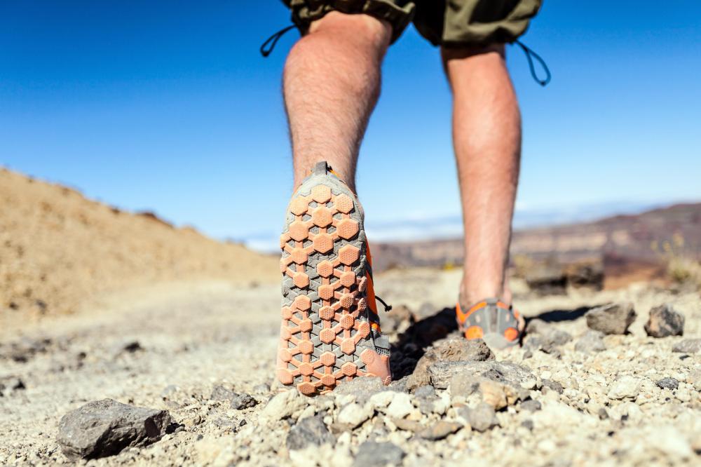 A geochemist may need to hike to a research site.