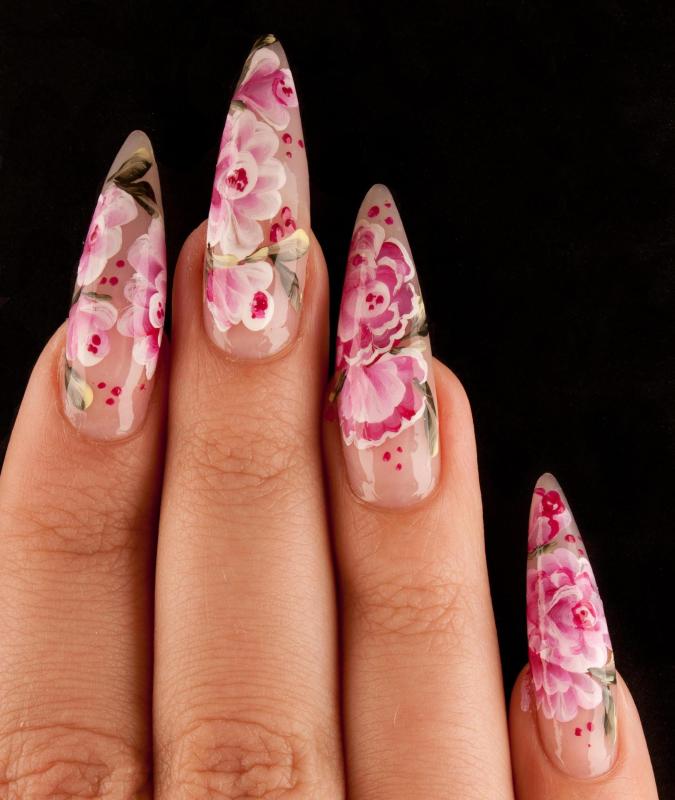 Artificial fingernails applied by a beautician.