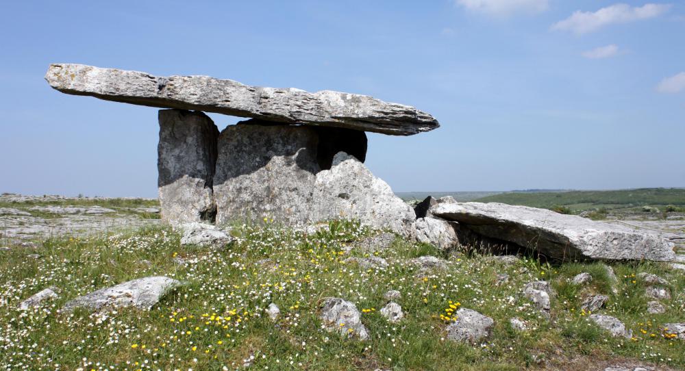 Archaeologists study prehistoric burial sites, such as the megalithic dolmens that can be found throughout Ireland, for clues as to how people once lived.