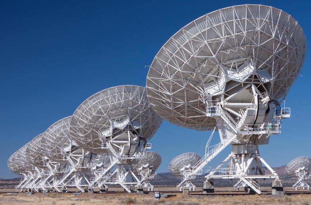 Astrophysicists use data from radio telescopes to formulate theories that explain the evolution of celestial objects.