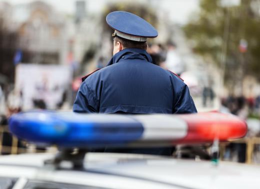 Police officers usually set up a perimeter at crime scenes to prevent evidence tampering.