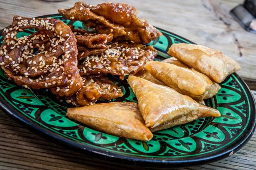 A community dietitian may educate people about the long-term dangers of eating fatty and fried foods.