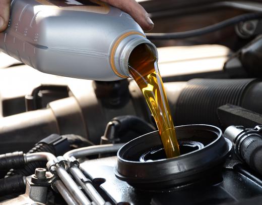 Changing oil is a common job for auto mechanics.
