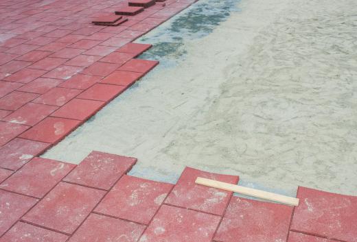 Paving contractors may lay down walkways composed of paving blocks.