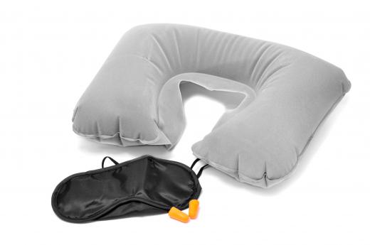 A corporate flight attendant may provide complimentary neck pillows and ear plugs to passengers.