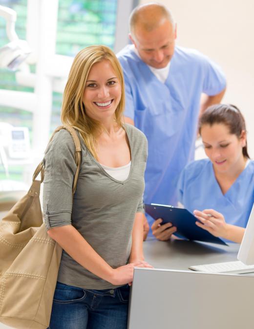 A medical insurance specialist may help patients determine whether or not a co-payment is due at the time of service.