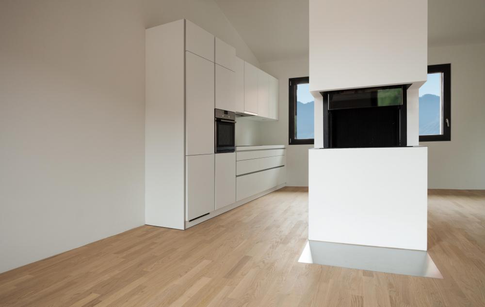 An interior designer configures a home's living spaces to match the aesthetic preferences of its owner.