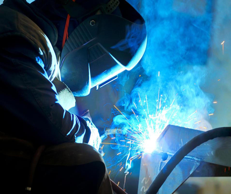 Welders must wear a helmet while welding to protect their faces from sparks and flying materials.