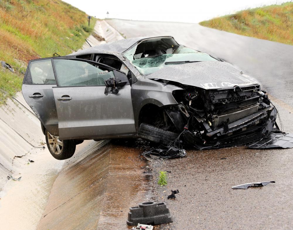 A news anchor reports on breaking stories, such as vehicle accidents.