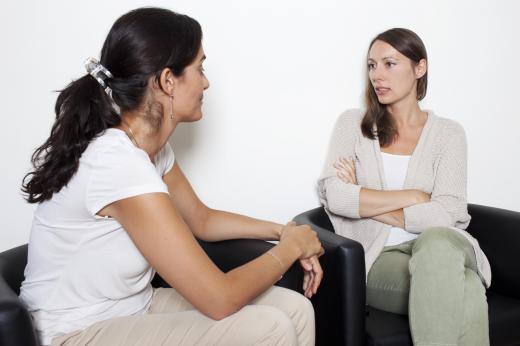 Body language experts say that someone who has their arms crossed while in conversation may be feeling defensive.