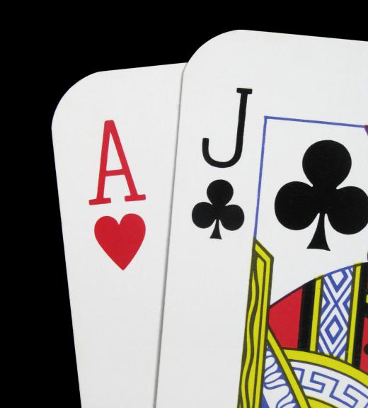 A blackjack dealer deals cards to gamblers who hope to get as close to 21 as they can without going over.