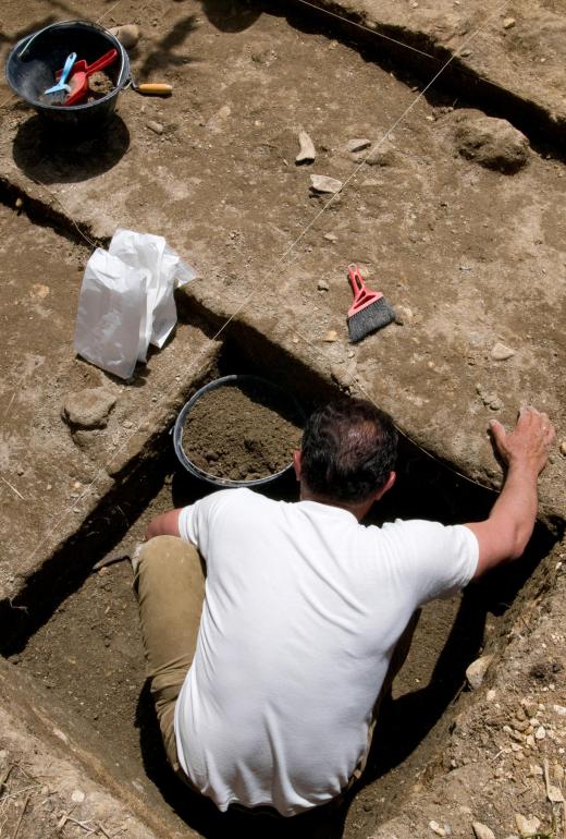 Archaeologists excavate sites and retrieve artifacts.