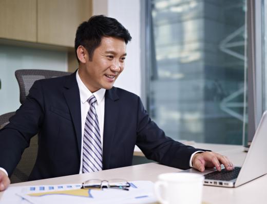 Auditors operate behind the scenes in a bank.