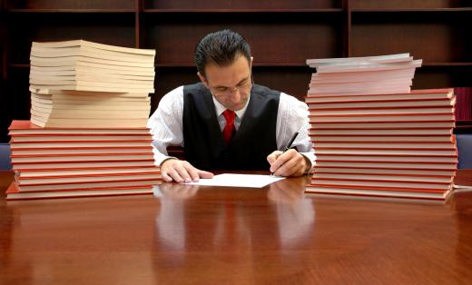 An asbestos attorney reviews the case file, organizes the records, and drafts initial discovery requests to the other party.