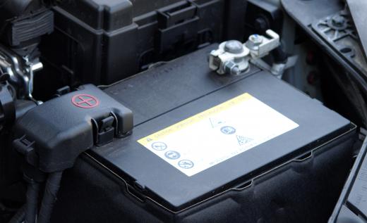 An auto diagnostic technician may test a car's battery.