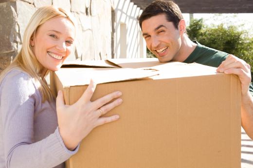 Furniture assemblers assist with the delivery of new pieces.