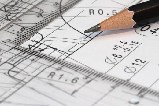 A scaffolding erector constructs scaffolding based on blueprints.