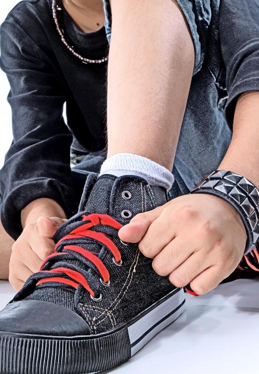 Some kids learn to tie their shoes for the first time by watching instructional videos.