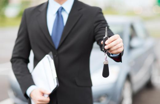 A car salesman may take interested car buyers on test drives.