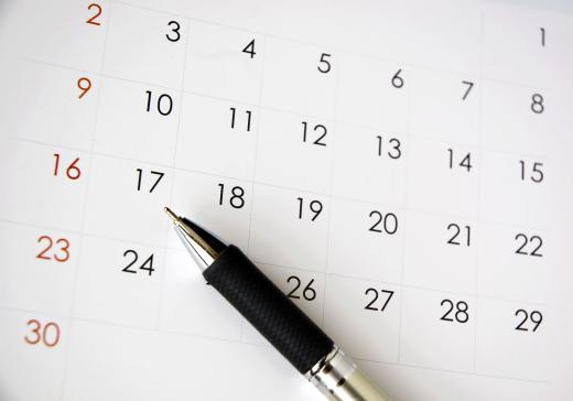 Receptionists often make appointments for clients using a calendar.