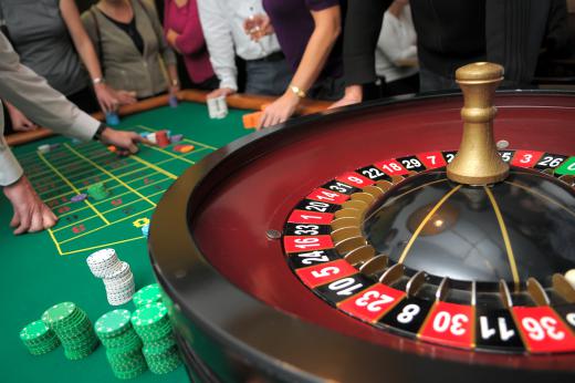 Croupiers are in charge of spinning the wheel during a game of roulette.