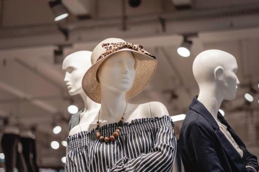 A retail clerk in a clothing store may be responsible for dressing mannequins in seasonal outfits.