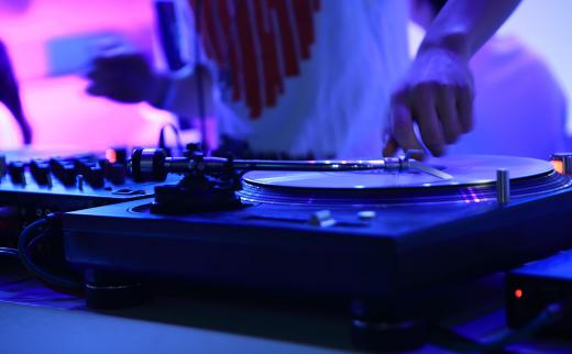 A mobile disc jockey travels to special events with mobile sound systems.