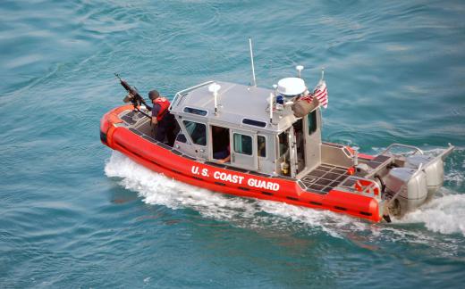 The crew of a U.S. Coast Guard harbor patrol boat inspects waterways for signs of terrorism or other criminal activity.