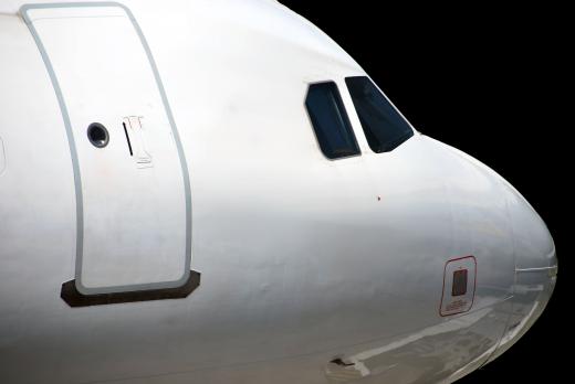 Flight engineers in older commercial jets work from an aircraft's cockpit.