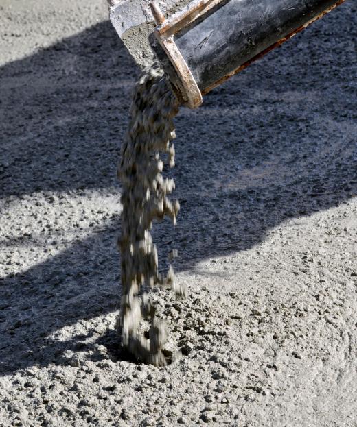 Wet concrete being poured.