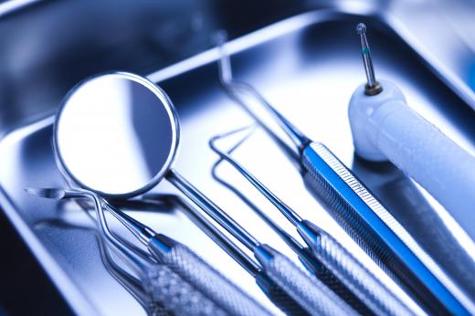 Dental hygienists use several tools during a routine dental cleaning.