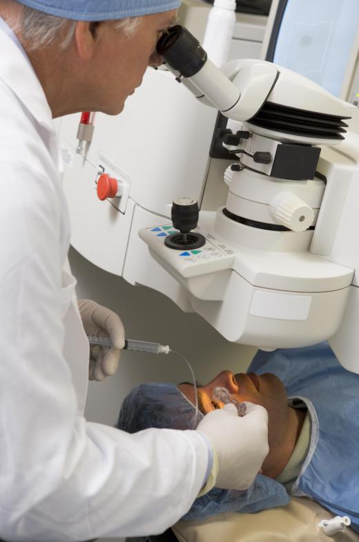 An ophthalmologist performs surgery on the eyes.