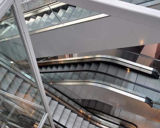 A mechanical engineer might be employed to design a building's escalators after a structural engineer finishes his work.