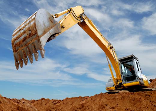 Excavators are machines that use a long boom and stick, often called an 'arm', to dig out and move earth.