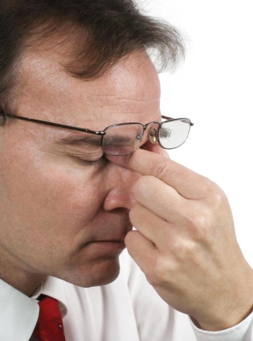 A software engineer may experience chronic eye strain from computer work.