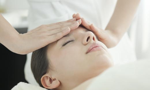 An aesthetician may apply skin care treatments in a spa.