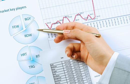 A report coordinator uses charts and graphs to prepare reports.