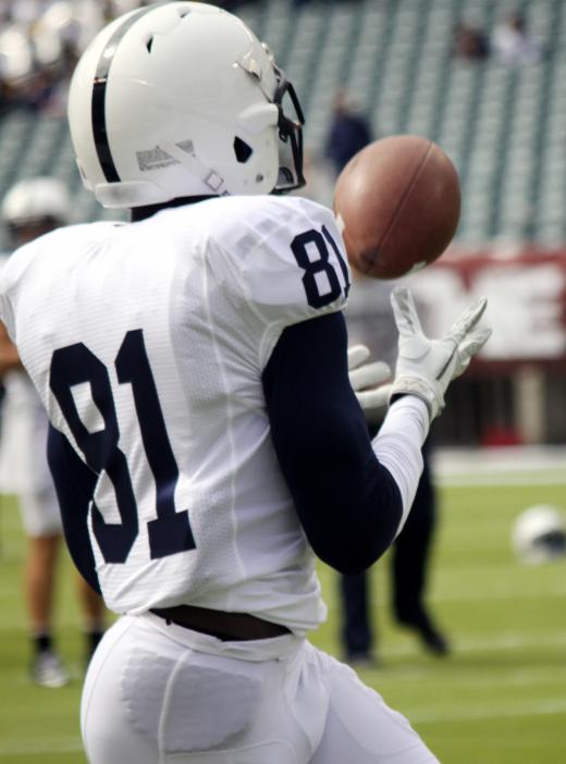 A play-by-play announcer gives details of the action, such as when passes are completed.