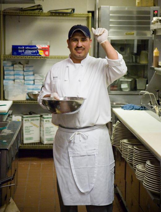 Sous chefs supervise for safety and proper food preparation.